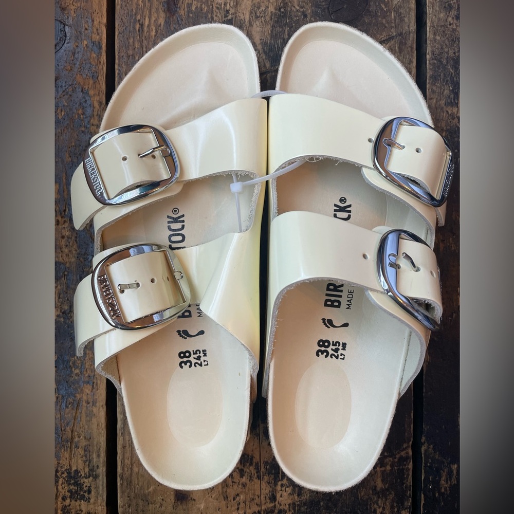 Birkenstock Cream Sandals with Silver Buckles